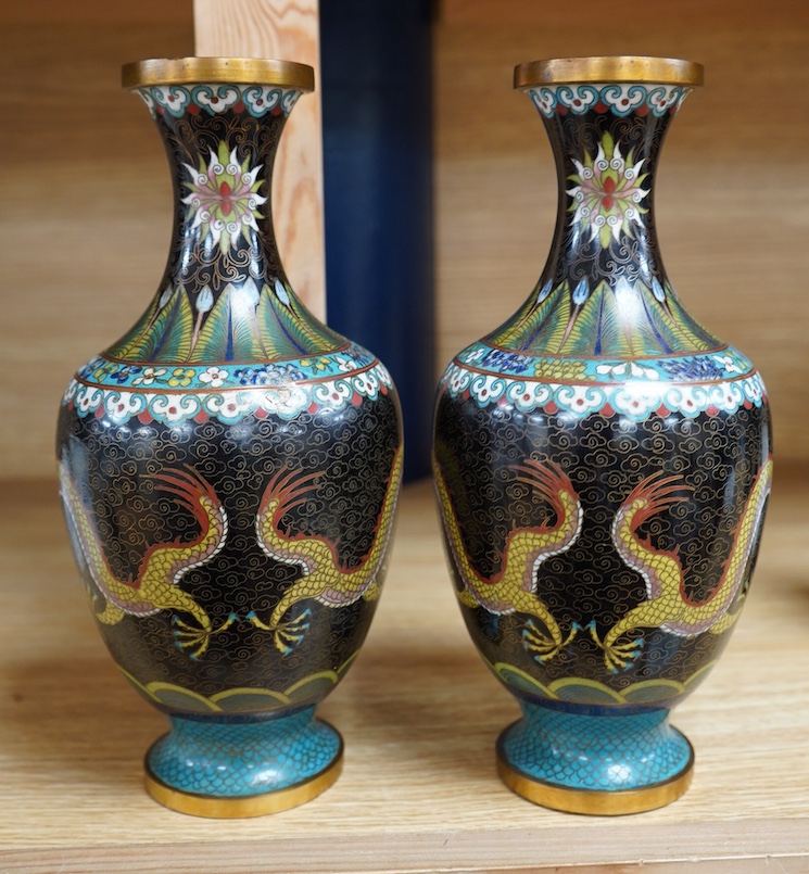 A pair of Chinese cloisonné black enamel ground vases, 23cm high. Condition - good.